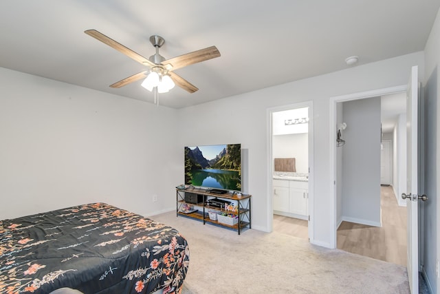 15560 Briar Forest Dr, Conroe, TX 77306 - bedroom with light colored carpet, ensuite bathroom, ceiling fan, and baseboards