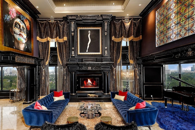 101 Westcott St Unit 2001, Houston, TX 77007 - living area with a towering ceiling, a large fireplace, crown molding, and a raised ceiling