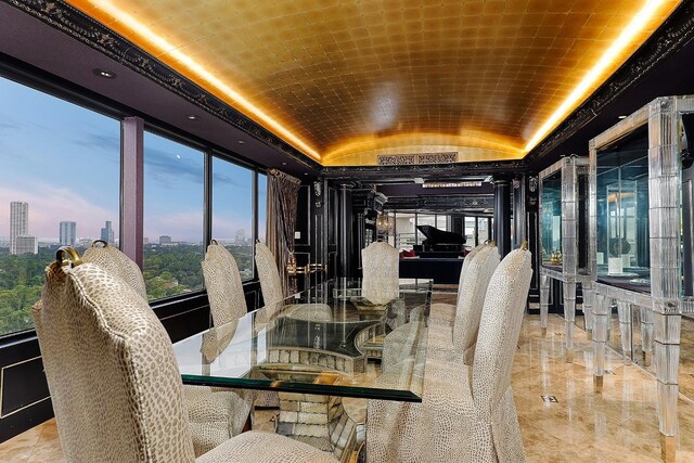 101 Westcott St Unit 2001, Houston, TX 77007 - dining room featuring a city view, brick ceiling, and lofted ceiling
