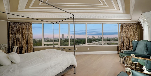 101 Westcott St Unit 2001, Houston, TX 77007 - bedroom featuring a city view, baseboards, ornamental molding, and wood finished floors