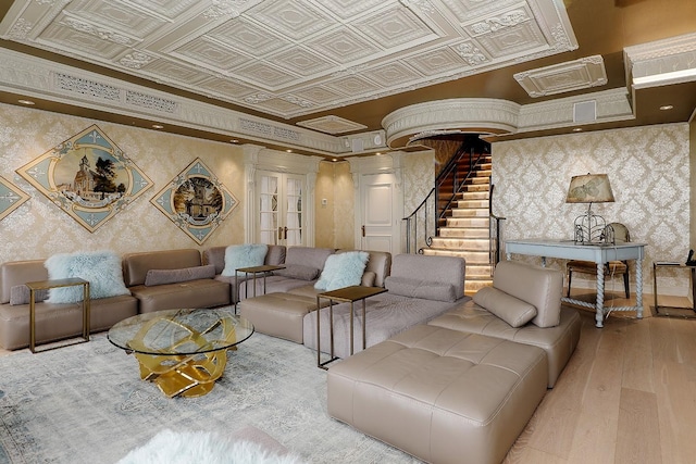 101 Westcott St Unit 2001, Houston, TX 77007 - living room with crown molding, stairway, wood finished floors, wallpapered walls, and an ornate ceiling