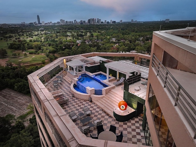 101 Westcott St Unit 2001, Houston, TX 77007 - wooden terrace with a pergola, a pool with connected hot tub, a patio, a view of city, and a gazebo