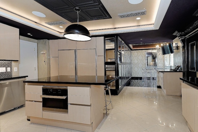 101 Westcott St Unit 2001, Houston, TX 77007 - kitchen featuring stainless steel appliances, visible vents, a tray ceiling, and dark countertops