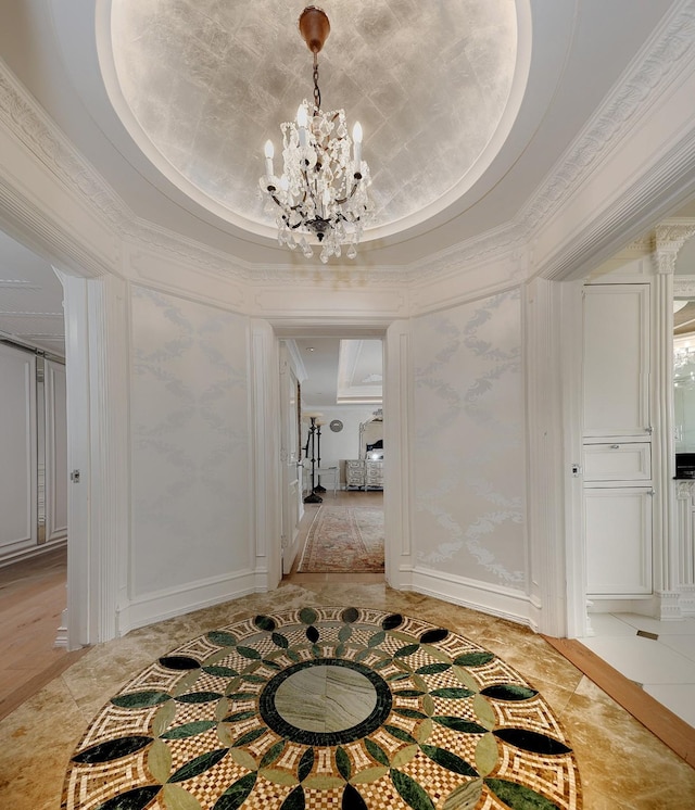 101 Westcott St Unit 2001, Houston, TX 77007 - corridor featuring baseboards, a tray ceiling, an inviting chandelier, and ornamental molding
