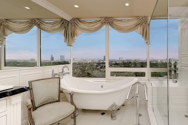 101 Westcott St Unit 2001, Houston, TX 77007 - bathroom featuring a city view, a soaking tub, recessed lighting, and tile patterned floors