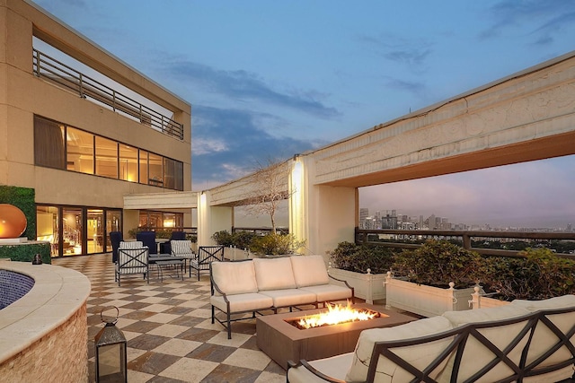 101 Westcott St Unit 2001, Houston, TX 77007 - patio terrace at dusk with an outdoor living space with a fire pit