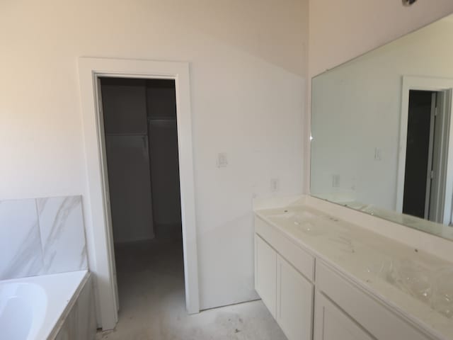 8042 Kay Harbor Dr, Cypress, TX 77433 - full bathroom with vanity, a garden tub, and concrete floors