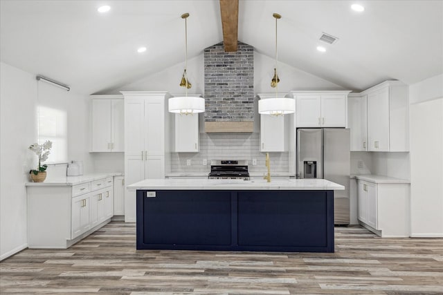 kitchen with lofted ceiling with beams, white cabinetry, stainless steel appliances, and light wood finished floors