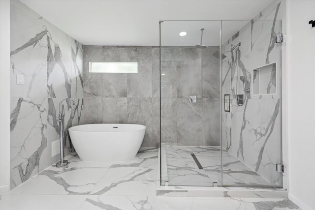 full bath with a marble finish shower, recessed lighting, marble finish floor, and a soaking tub