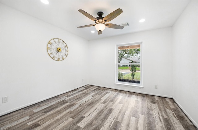 spare room with visible vents, baseboards, recessed lighting, wood finished floors, and a ceiling fan