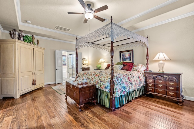 2469 S Bramlet Dr, Conroe, TX 77304 - bedroom with wood-type flooring, crown molding, baseboards, and a ceiling fan