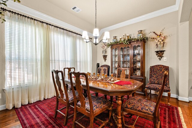 2469 S Bramlet Dr, Conroe, TX 77304 - dining area with a chandelier, ornamental molding, wood-type flooring, and baseboards