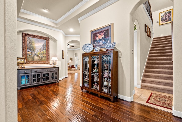 2469 S Bramlet Dr, Conroe, TX 77304 - hall featuring arched walkways, hardwood / wood-style floors, ornamental molding, stairway, and baseboards