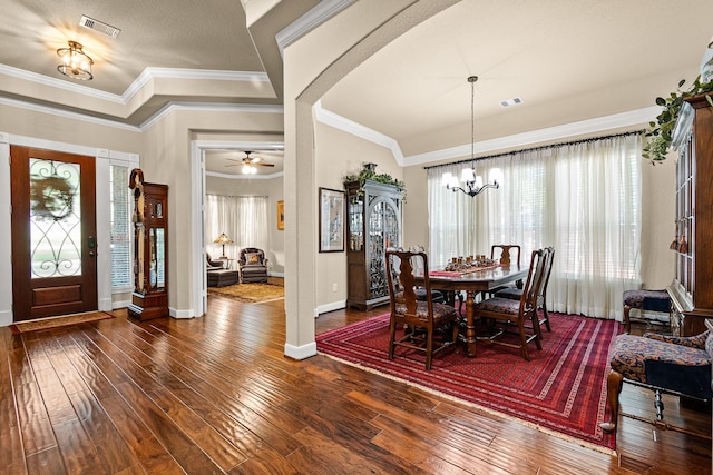 2469 S Bramlet Dr, Conroe, TX 77304 - dining area featuring dark wood finished floors, a chandelier, baseboards, and crown molding