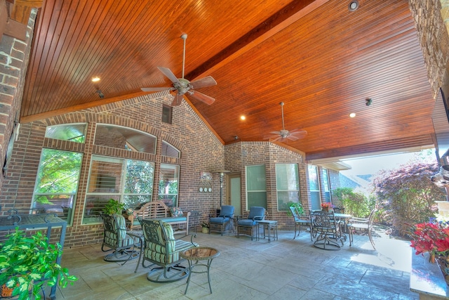 view of patio with a ceiling fan and outdoor dining space