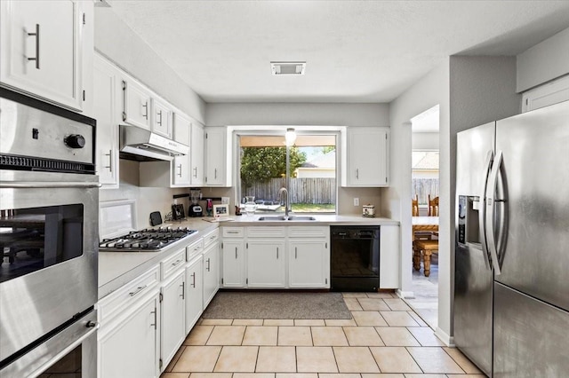 15707 Spring Forest Dr, Houston, TX 77059 - kitchen with stainless steel appliances, a sink, under cabinet range hood, and light countertops