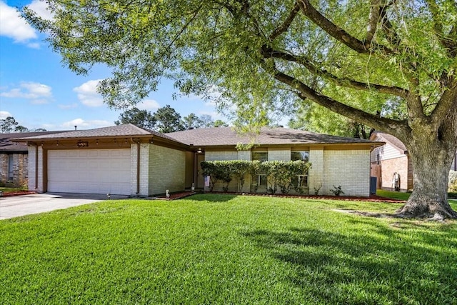 15707 Spring Forest Dr, Houston, TX 77059 - single story home featuring a garage, a front yard, driveway, and brick siding
