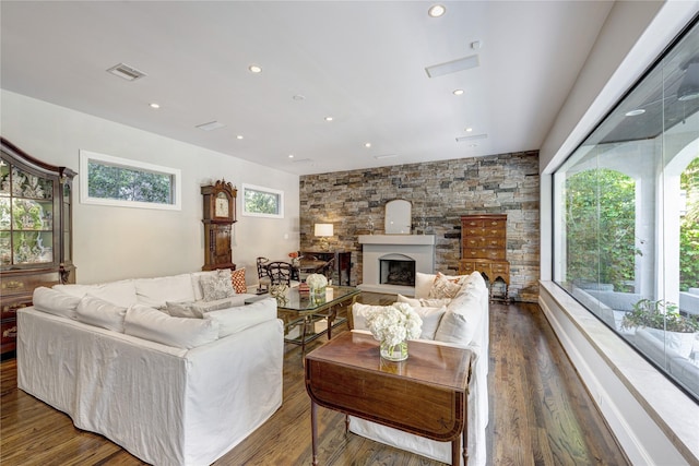 609 Reinicke St, Houston, TX 77007 - living area with visible vents, recessed lighting, a fireplace with raised hearth, and wood finished floors