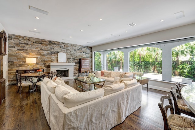 609 Reinicke St, Houston, TX 77007 - living room with visible vents, dark wood-style floors, recessed lighting, and a fireplace