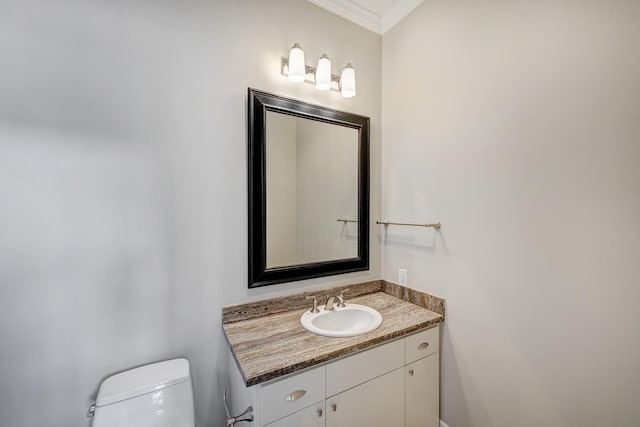 609 Reinicke St, Houston, TX 77007 - half bath with vanity, ornamental molding, and toilet