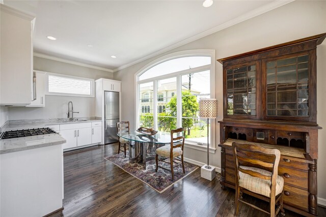 609 Reinicke St, Houston, TX 77007 - dining space with dark wood-type flooring, ornamental molding, baseboards, and recessed lighting