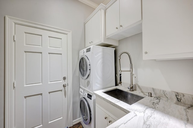 609 Reinicke St, Houston, TX 77007 - laundry room with a sink, cabinet space, and stacked washer / drying machine