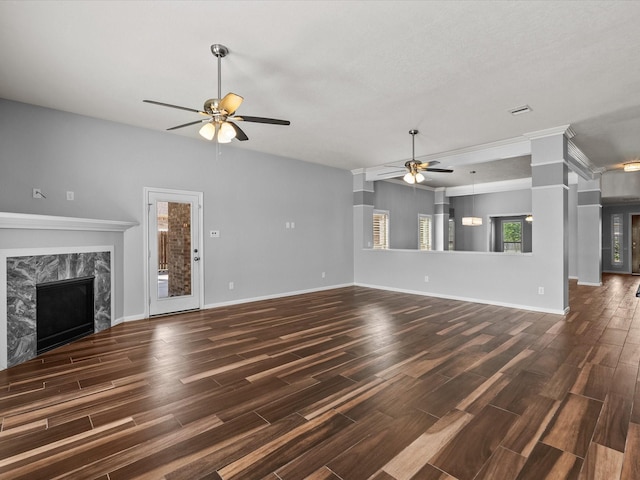 2001 Sedona Dr, League City, TX 77573 - unfurnished living room with ceiling fan, dark wood-type flooring, a fireplace, and baseboards