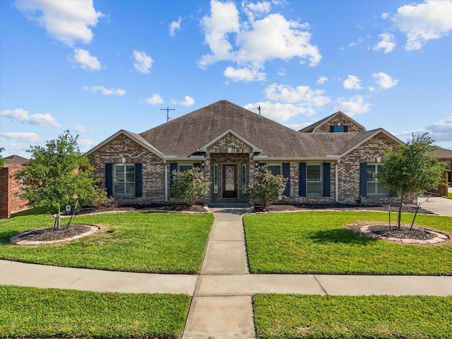 2001 Sedona Dr, League City, TX 77573 - view of front of home with a front lawn, brick siding, and roof with shingles