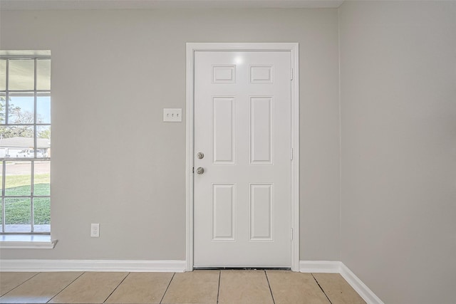 8719 Valley Meadow Dr, Houston, TX 77078 - doorway featuring light tile patterned floors and baseboards