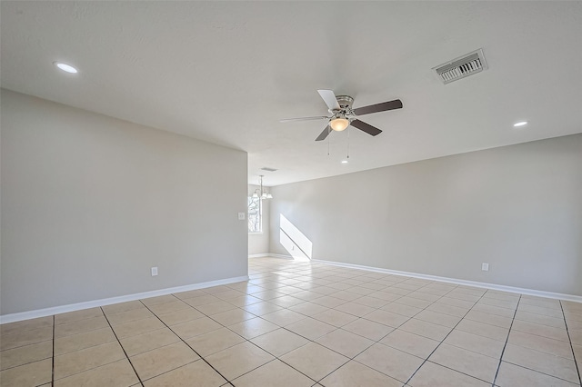 8719 Valley Meadow Dr, Houston, TX 77078 - empty room with baseboards, recessed lighting, light tile patterned floors, visible vents, and ceiling fan with notable chandelier