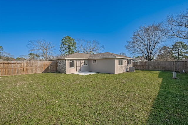 8719 Valley Meadow Dr, Houston, TX 77078 - back of property with a yard, central air condition unit, and a fenced backyard