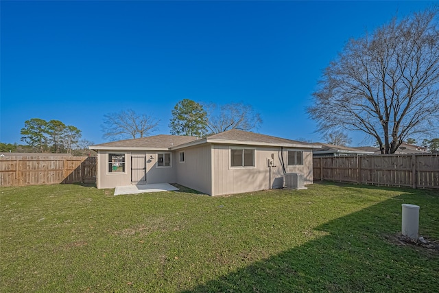 8719 Valley Meadow Dr, Houston, TX 77078 - rear view of house with a yard, a fenced backyard, cooling unit, and a patio area