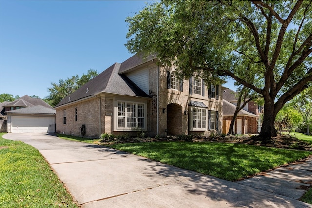 15122 Windsdowne Ln, Cypress, TX 77429 - view of front facade with brick siding, a front lawn, and a detached garage