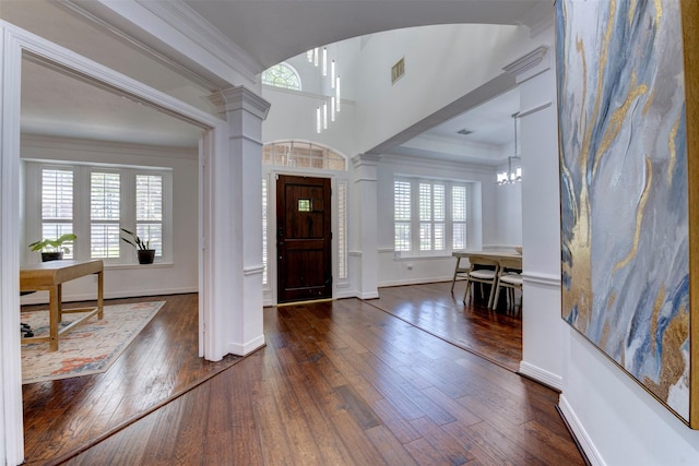 15122 Windsdowne Ln, Cypress, TX 77429 - entrance foyer with wood-type flooring, crown molding, a chandelier, and decorative columns