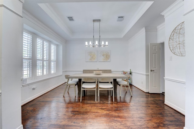 15122 Windsdowne Ln, Cypress, TX 77429 - dining space featuring a chandelier, a tray ceiling, dark wood-type flooring, and ornamental molding