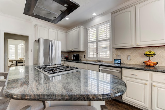 15122 Windsdowne Ln, Cypress, TX 77429 - kitchen with stainless steel appliances, exhaust hood, ornamental molding, a center island, and backsplash