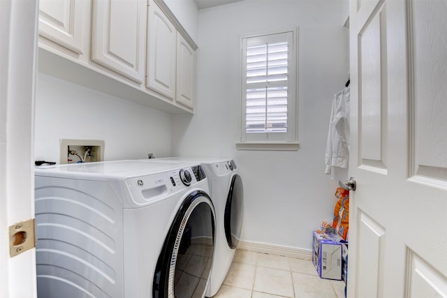 15122 Windsdowne Ln, Cypress, TX 77429 - laundry area with washing machine and clothes dryer, cabinet space, and light tile patterned floors