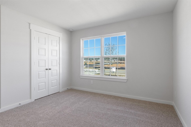 4741 Peony Green Dr, Katy, TX 77493 - unfurnished bedroom featuring carpet floors, a closet, and baseboards