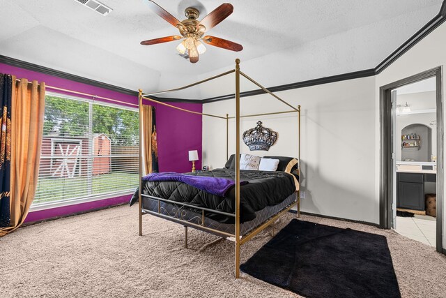 bedroom featuring a textured ceiling, visible vents, carpet, lofted ceiling, and connected bathroom