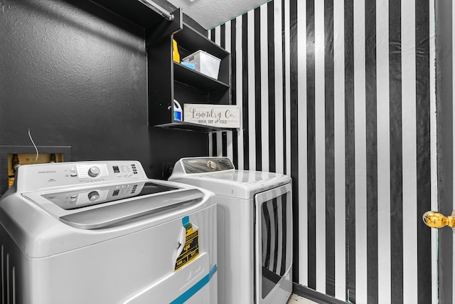 clothes washing area featuring washing machine and dryer