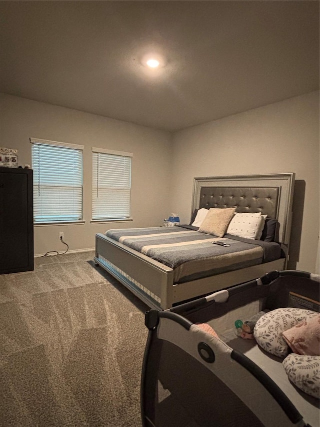 carpeted bedroom with baseboards