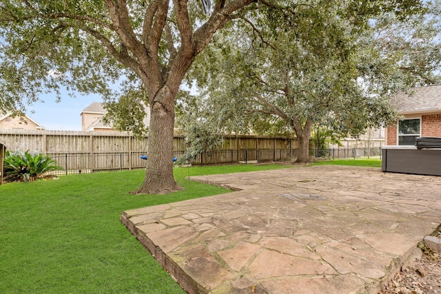 view of yard featuring a patio and a fenced backyard