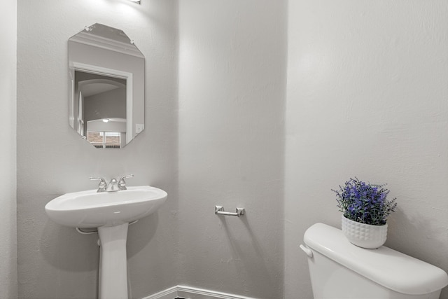 half bathroom with toilet