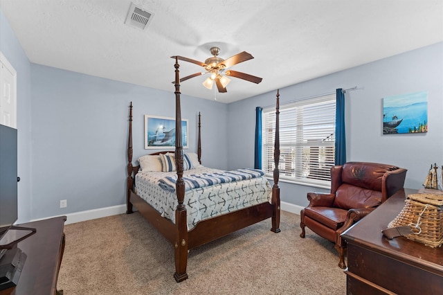 carpeted bedroom with baseboards and a ceiling fan