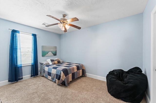 bedroom with carpet floors, baseboards, and a ceiling fan