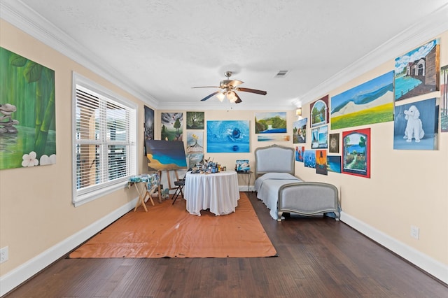 sitting room with hardwood / wood-style floors, crown molding, ceiling fan, baseboards, and a textured ceiling
