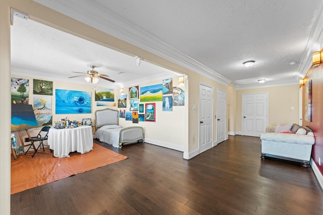 bedroom with crown molding, wood finished floors, a textured ceiling, baseboards, and ceiling fan