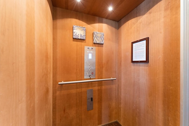 elevator featuring wooden ceiling
