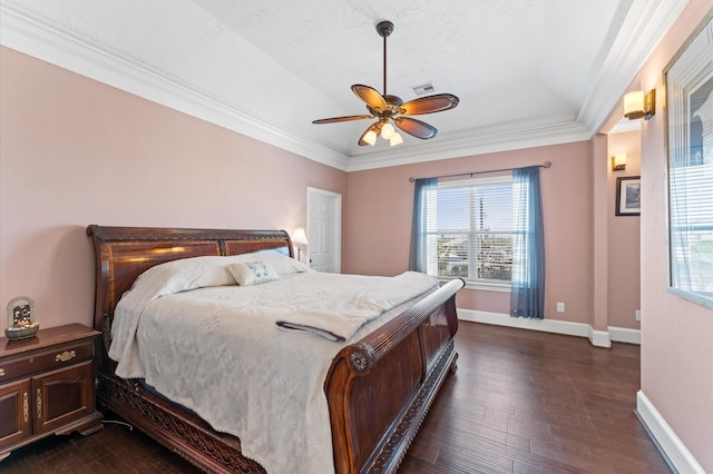 bedroom featuring crown molding, dark wood-type flooring, baseboards, and a ceiling fan