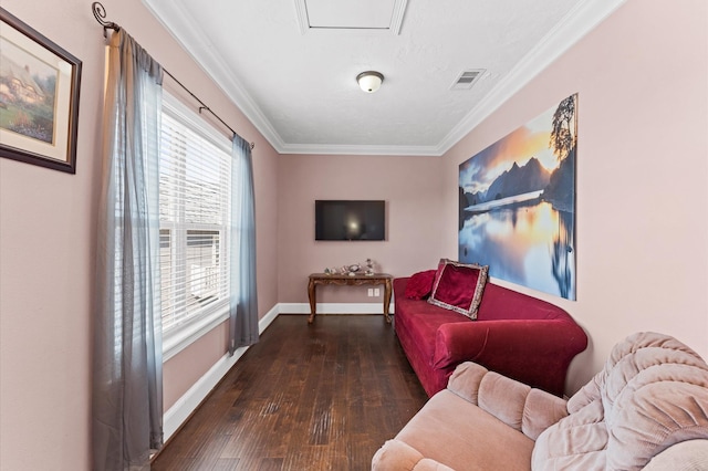 sitting room featuring hardwood / wood-style flooring, baseboards, and crown molding